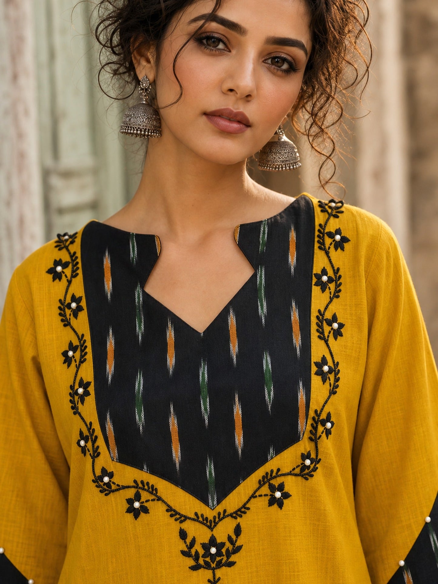 Bold Mustard Cotton Kurta with Black Ikat V-Yoke & Floral Embroidery with Pearl Accent Detail