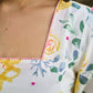 Luminous White Cotton Floral Dress with Square Neck, Contrasting Pink Accents, Flared Silhouette & Voluminous Puffy Sleeves