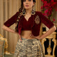 Madhubani print lehenga with a scalloped hem, paired with a rich maroon velvet blouse - Short Jacket with elegant brooch style embroidery Optional