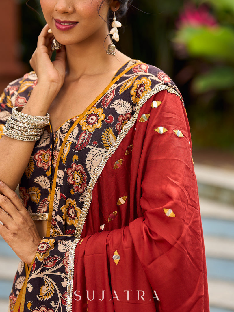 Traditional Rust Modal Silk Saree with Hand Embroidered Mirror Work & Kalamkari Printed Border