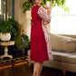 Jaipur-printed maroon floral crossover dress featuring a wrap-style silhouette with a coordinating floral tie-up, creating a flattering cinched waist and a breezy, feminine flow.