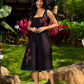 Chic Black Cotton Dress With Handcrafted Red Floral Applique And Contrast Green Detailing