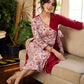 Jaipur-printed maroon floral crossover dress featuring a wrap-style silhouette with a coordinating floral tie-up, creating a flattering cinched waist and a breezy, feminine flow.