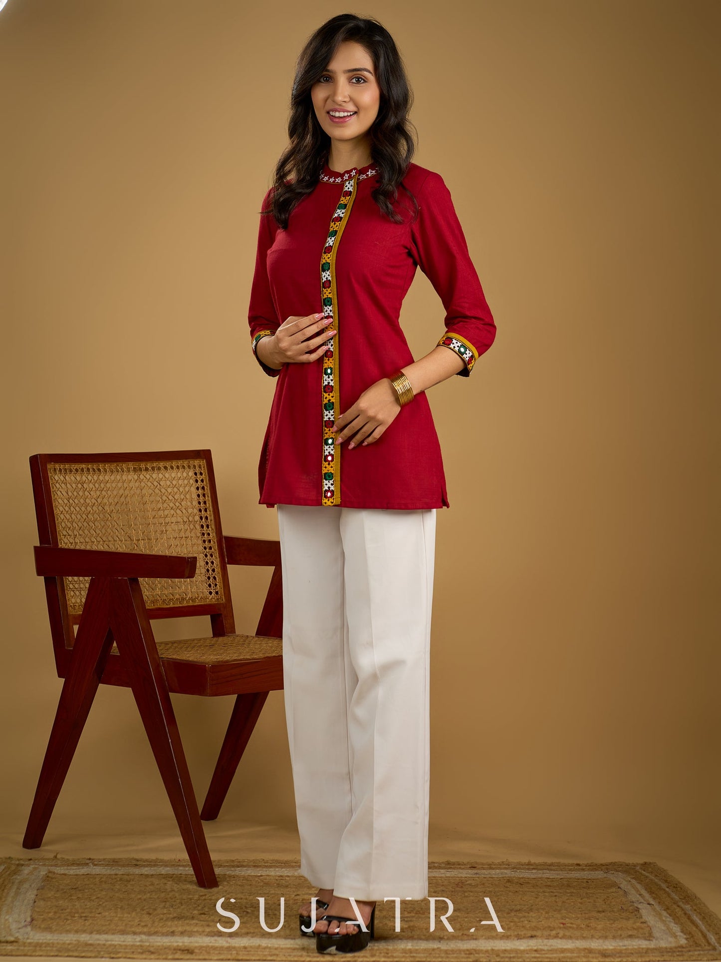 Elegant maroon cotton top featuring mirror work and side collar.