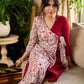 Jaipur-printed maroon floral crossover dress featuring a wrap-style silhouette with a coordinating floral tie-up, creating a flattering cinched waist and a breezy, feminine flow.