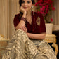 Madhubani print lehenga with a scalloped hem, paired with a rich maroon velvet blouse - Short Jacket with elegant brooch style embroidery Optional