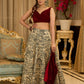 Madhubani print lehenga with a scalloped hem, paired with a rich maroon velvet blouse - Short Jacket with elegant brooch style embroidery Optional