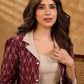Smart maroon Ikat jacket featuring gathered sleeves, a cream notch collar, and subtle accents, creating a defined, structured silhouette suited for polished corporate wear.