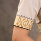 Off White and Mustard Elbow Sleeve Blouse with Contrast Piping and Hand Painted Gond Art on Back