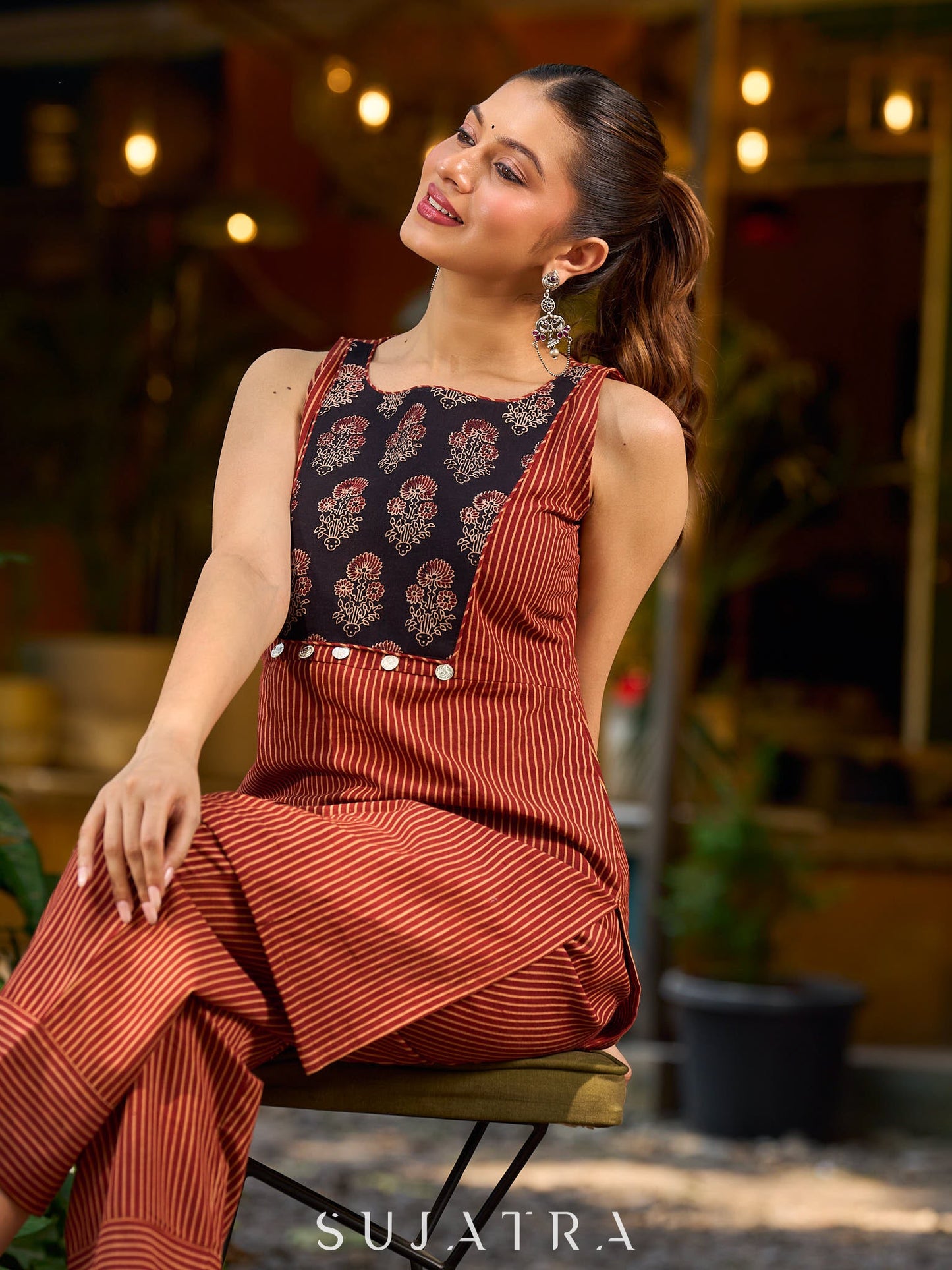 Handcrafted Maroon Ajrakh stripe kurta with a black floral patch