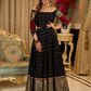 Black cotton silk & brocade lehenga paired with a sculpted corset style choli featuring intricate stonework on sleeves .
