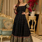 Black cotton silk & brocade lehenga paired with a sculpted corset style choli featuring intricate stonework on sleeves .