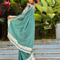 Vibrant Sea Green Modal Saree with Ivory Chevron Border & Minimal Hand Embroidery