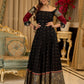 Black cotton silk & brocade lehenga paired with a sculpted corset style choli featuring intricate stonework on sleeves .