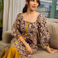 Heritage Kalamkari dress with elegant mustard accents and black pearl embellishments.