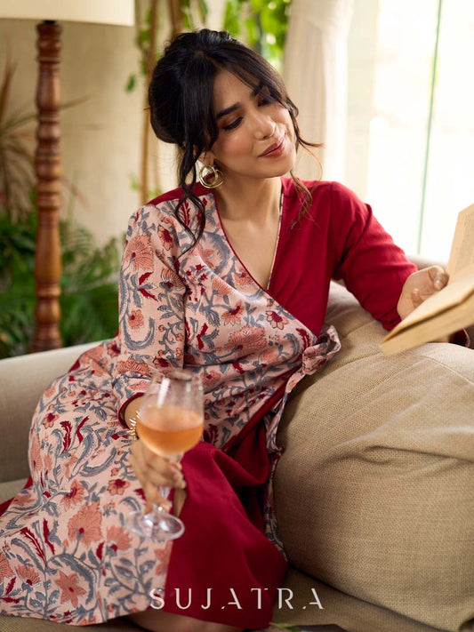 Jaipur-printed maroon floral crossover dress featuring a wrap-style silhouette with a coordinating floral tie-up, creating a flattering cinched waist and a breezy, feminine flow.