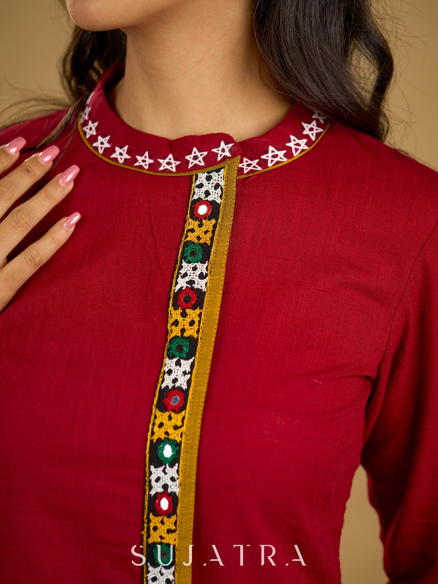Elegant maroon cotton top featuring mirror work and side collar.