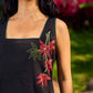 Chic Black Cotton Dress With Handcrafted Red Floral Applique And Contrast Green Detailing