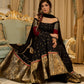 Black cotton silk & brocade lehenga paired with a sculpted corset style choli featuring intricate stonework on sleeves .