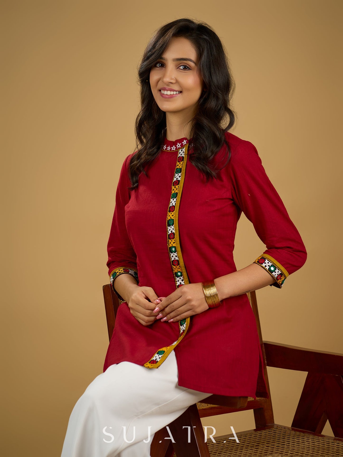 Elegant maroon cotton top featuring mirror work and side collar.