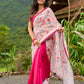 Floral-inspired white saree elevated with fuchsia pleats and borders