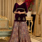 Royal Wine Lehenga with a scalloped hem and a luxurious velvet choli with Zardosi work .