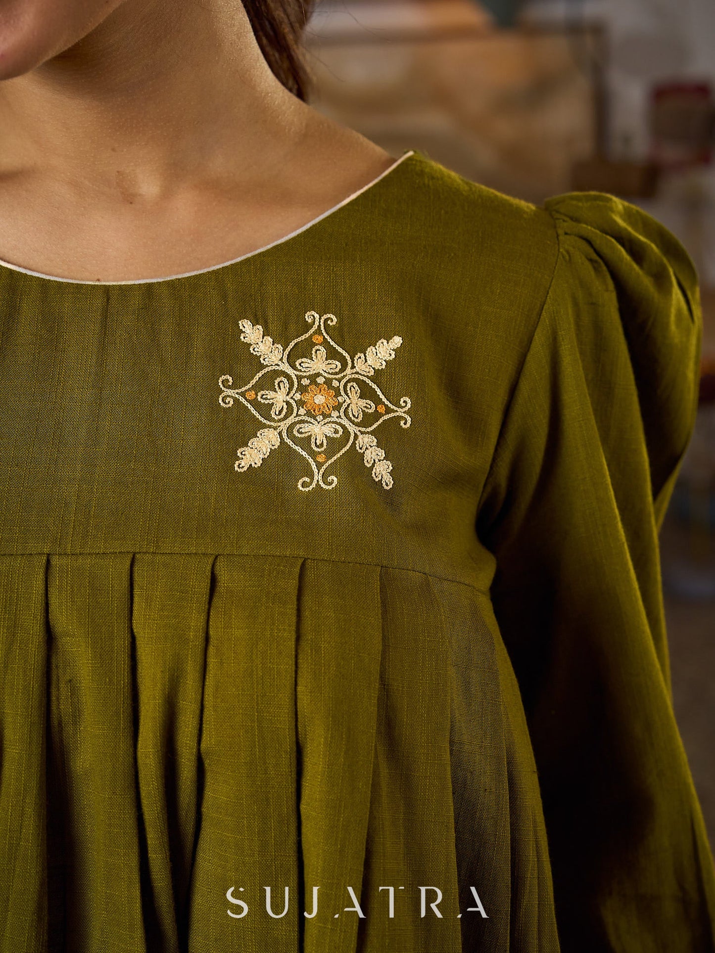 Contemporary Olive Green Pleated Top Adorned With Subtle Hand Embroidery & Refined Off White Accents