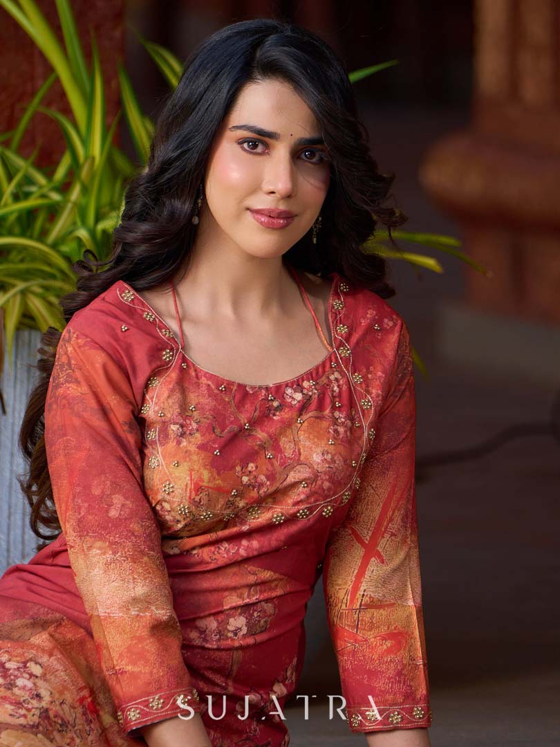 Amber crimson blossom printed kurta with golden pearl handwork on the yoke and dainty tie-up neck details.