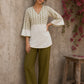 Contemporary off white and olive hand block print top features subtle geometric motifs, airy bell sleeves, and effortless elegance for versatile everyday styling.