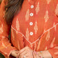 Tangerine Weave Ikat Top with Asymmetrical Panel and Statement Buttons