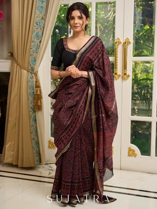 Pure Maheshwari saree with bold Ajrakh prints and regal zari border