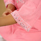 Elegant baby pink cotton top highlighted with subtle thread embroidery