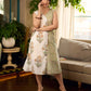 Jaipur-printed sleeveless dress featuring a half-and-half butta and jaal combination, designed with an overlapping silhouette, soft drop shoulders, and wooden accents for an artisanal, contemporary look.
