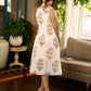 Jaipur-printed sleeveless dress featuring a half-and-half butta and jaal combination, designed with an overlapping silhouette, soft drop shoulders, and wooden accents for an artisanal, contemporary look.
