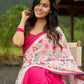 Floral-inspired white saree elevated with fuchsia pleats and borders