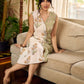 Jaipur-printed sleeveless dress featuring a half-and-half butta and jaal combination, designed with an overlapping silhouette, soft drop shoulders, and wooden accents for an artisanal, contemporary look.