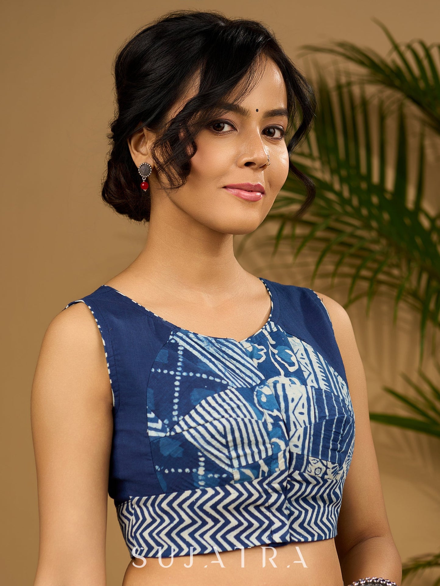 Unique indigo patchwork cotton sleeveless blouse.