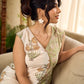 Jaipur-printed sleeveless dress featuring a half-and-half butta and jaal combination, designed with an overlapping silhouette, soft drop shoulders, and wooden accents for an artisanal, contemporary look.