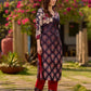 Statement black kurta with Kalamkari-inspired ombré prints and vibrant red touches.