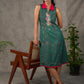 Bottle green Madhubani printed dress with vibrant magenta accents.