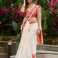 Ivory elegance with royal red Banarasi border, timeless festive glamour