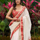 Ivory elegance with royal red Banarasi border, timeless festive glamour