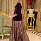 Royal Wine Lehenga with a scalloped hem and a luxurious velvet choli with Zardosi work .