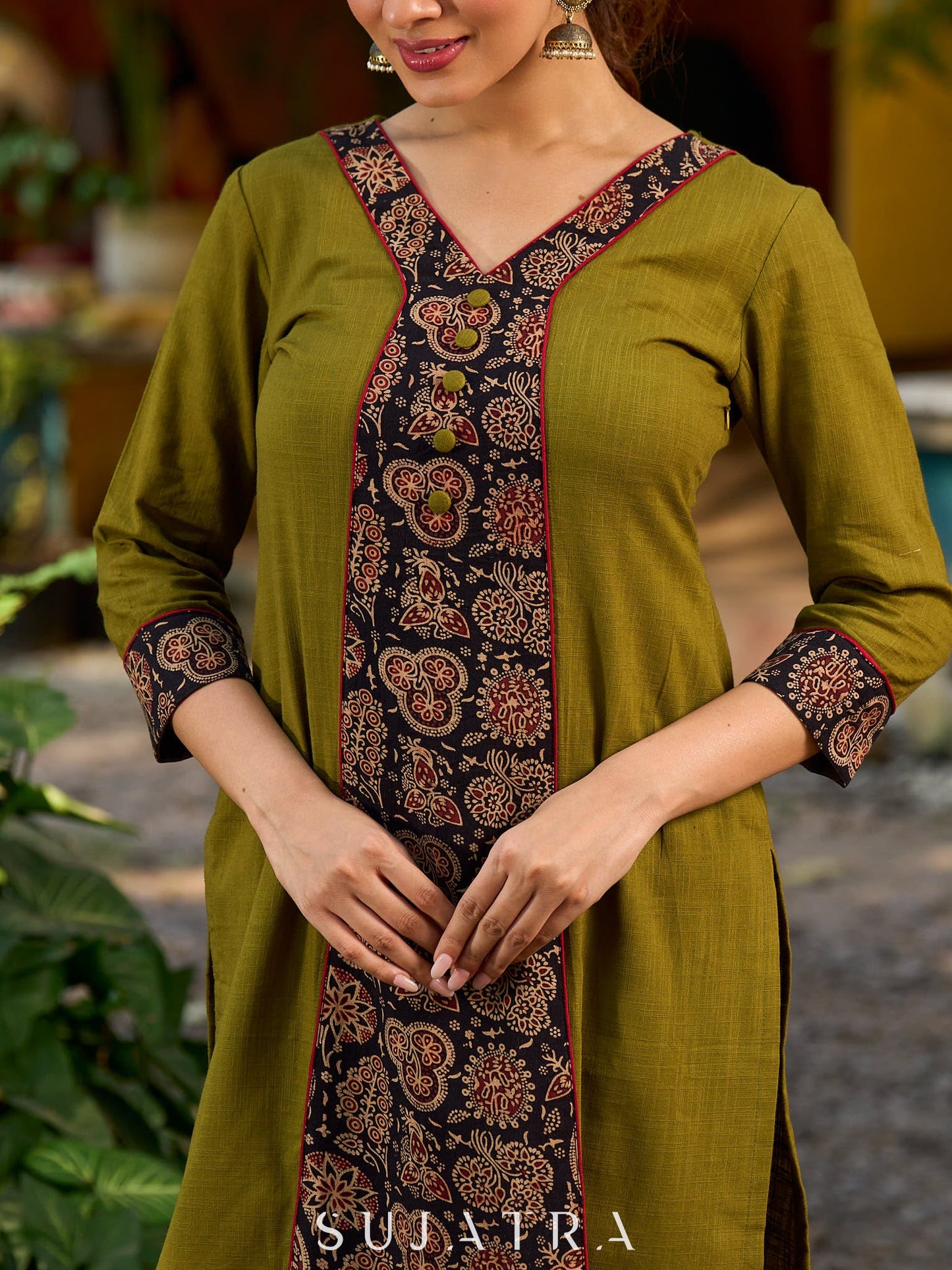 Olive kurta elevated with a black Ajrakh centre panel and Maroon details