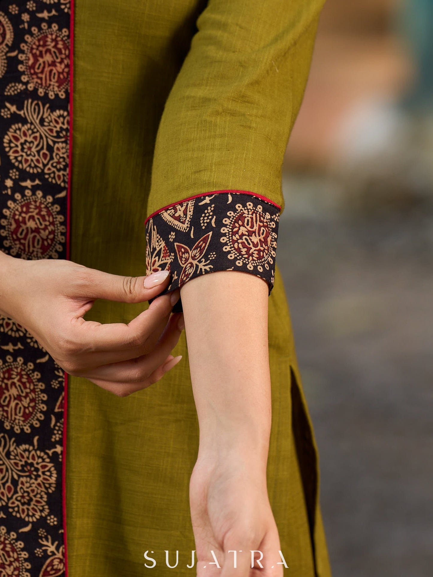 Olive kurta elevated with a black Ajrakh centre panel and Maroon details