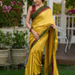 Vibrant yellow silk mix saree with hand block printed Ajrakh border
