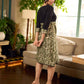 Olive floral dress featuring a contrasting black yoke, designed in a straight fit and highlighted with subtle floral accents for a clean, elegant earthy look