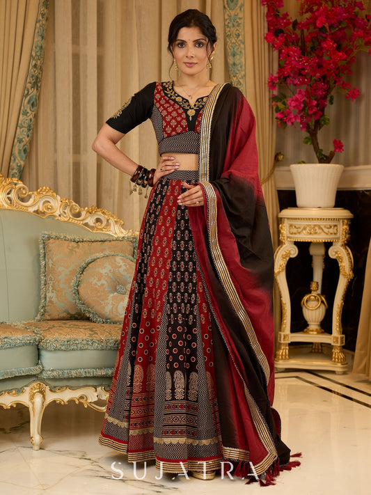 Handcrafted maroon & black Ajrakh print lehenga paired with an embroidered blouse for rich artisanal look - Dupatta Optional