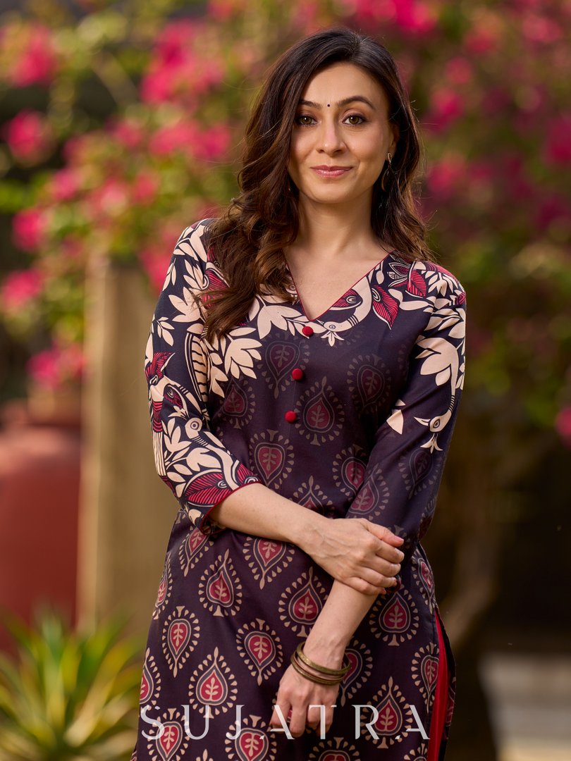 Statement black kurta with Kalamkari-inspired ombré prints and vibrant red touches.