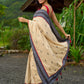 Beige cotton saree enriched with traditional Ikat border and Jamdani accents